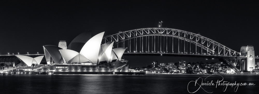 Australia -Iconic View of Sydney Opera House and Harbour Bridge in Sydney Harbour BW